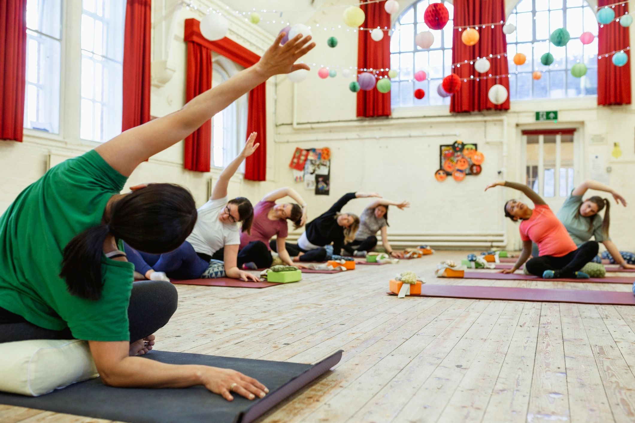Yoga instructor leading a class in studio